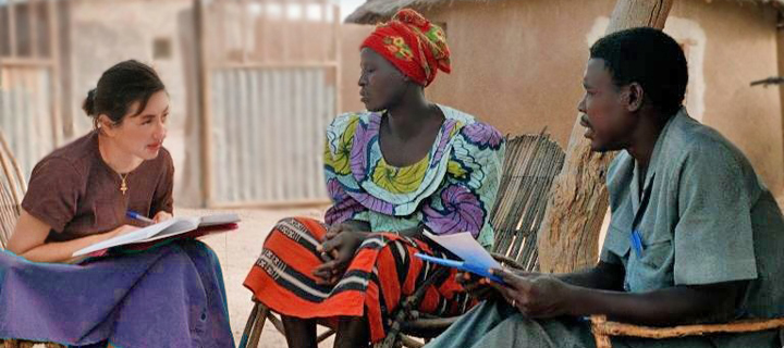Carla Roncoli and research assistant Salif Boena interview a woman farmer on her access to and use of seasonal rainfall forecasts, Central Plateau, Burkina Faso. Photo courtesy Carla Roncoli