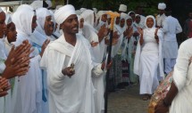 Title: Students during Orthodox Easter at Hawassa University, Ethiopia Caption: Students at Hawassa University in Ethiopia in procession during Orthodox Easter (April 15, 2012) from the campus to St. Trinity's Church nearby. The degree of religious devotion among Ethiopian students seems unsurpassed, whether they are Orthodox Christian, Protestant evangelicals, or Muslims. But the Orthodox students in particular can be seen early everyday (between 6 AM and 8 AM) making their way to church for prayers, and returning before classes begin. All wear white shawls; student in the middle is a Deacon who is leading the singing.
