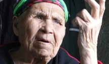 Title: Face of Change Caption: Babushka Daria Mulingaut was a well known and respected Koryak healer from Vyvenka, a coastal village on the Kamchatka Peninsula in Northeastern Siberia. When this 2011 photo was taken, she was at least 103 years old, though she often said she was much older. Born to a family of nomadic herders whose reindeer were collectivized during the Soviet era, she was fond of telling how her father traded reindeer meat for Winchester rifles with American whalers. After learning Russian in boarding schools, working in Soviet era collective farms, and surviving the chaos of perestroika, she finally passed on to another world in 2012.  