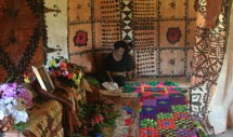 Title: The Chief's Widow (March 9, 2012, Yasawa-i-rara Village, Yasawa Island, Fiji) Caption: Surrounded by decorated barkcloth (masi) and pandanus mats interwoven with yarn, the wife of the late Tui Yasawa sits alone with his casket on the morning of his burial. She slept the night there in the chiefly Great House, wailing with women from her husbands clan. She will follow the procession of the casket to the Methodist church and then to the chiefly graveyard, where she will watch the late chiefs vasu relations wrap his casket in these mats and masi and lower it into the earth. When others disperse for feasting, she will remain behind with his sisters and nieces, weeping into the dirt under a rising tropical sun.