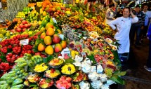Title: the Mercat de la Boqueria in Barcelona, Spain Caption: The Boqueria market in Barcelona, Spain is an excellent expression of the globalization of human food, with delightful treats from every region of the world artistically displayed for the shoppers.  