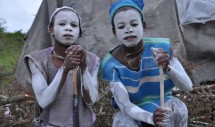 Category: PEOPLE

Title: A Boy Who Goes to Hospital is Never a Man

By: Christopher Morris

Eastern Cape, South Africa 
Caption: Two Xhosa boys in the process of becoming men in the Victoria East District of the Eastern Cape, South Africa. Despite its risks, ritual circumcision in the bush is strongly preferred to a hospital procedure in many areas of the Eastern Cape. These two boys were ritually circumcised by a local initiator (or "cutter") and now reside in a makeshift shelter. As their bodies heal over many weeks, the boys will be educated in the ways of Xhosa manhood.  
