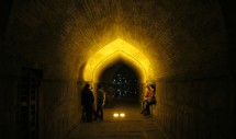 Title: 33 Bridges, Standing, Still, on a Fluid of Emotions - Esfahan, Iran (November 11, 2010) Caption: Si-o seh pol (33 bridges) has been standing in Esfahan, Iran since 1602. It has recently been deprived of water which used to flow under its arches. Yet, in the evenings, it remains as a site of human interaction, creating and recreating emotions of bonding, meetings between selves which turn a blind eye to what remains as secrets of the heart. 33 bridges stands above a dried-out river but never void of flowing emotions between human beings.