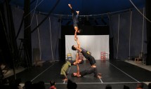 Title: A Fine Balance (Battambang, Cambodia, August 2011) Caption: Following the 1975-1979 Khmer Rouge genocide, Cambodian refugees created the Phare Ponleu Selpak Fine Arts School and Circus in Cambodia's northwestern territory of Battambang to help revive Cambodian culture. Today, the circus flourishes as a major tourist attraction and has even toured Europe. In this photo, students between eight and twenty four years of age perform for a mixed audience of Khmer and foreign nationals, demonstrating that a nation once walking a tightrope of survival has found balance once again.  