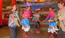 Title: Salween Swing Caption: Costumed Tibetan performers dance with local patrons at a disco in Chinas remote Nujiang Valley. Known as the Salween in English, the Nujiang borders Burma and Tibet and is home to Nu, Lisu, Tibetan, Drung and other ethnic minority groups.  