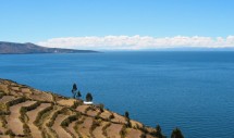 Amantaní (in the distance) viewed from Taquile (in the foreground) on Lake Titicaca, Peru. Public domain image via WikiMedia Commons