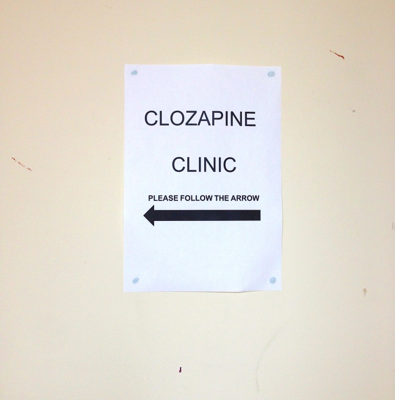 Photograph of a sign on a wall