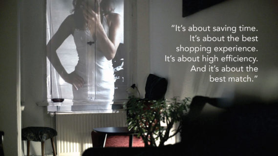 A photo of a woman taking a selfie of herself in the mirror, and figure-hugging sleeveless dress is projected onto the window shade of a small darkened apartment. The text in the photo, a quote from an interlocutor, reads: "It's about saving time. It's about the best shopping experience. It's about high efficiency. And it's about the best match."