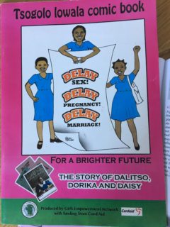 A booklet whose cover reads: Tsogolo Iowala comic book for a brighted future: the story of Dalitso, Dorika, and Daisu." The cover picture shows three girls holding a sign that reads: "Delay sex! Delay Pregnancy! Delay Marraige!" Book was produced by Girl's empowerment Network with funding from Cord Aid.