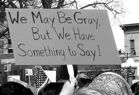Sign at a protest that reads, "We may be gray, but we have something to say!"