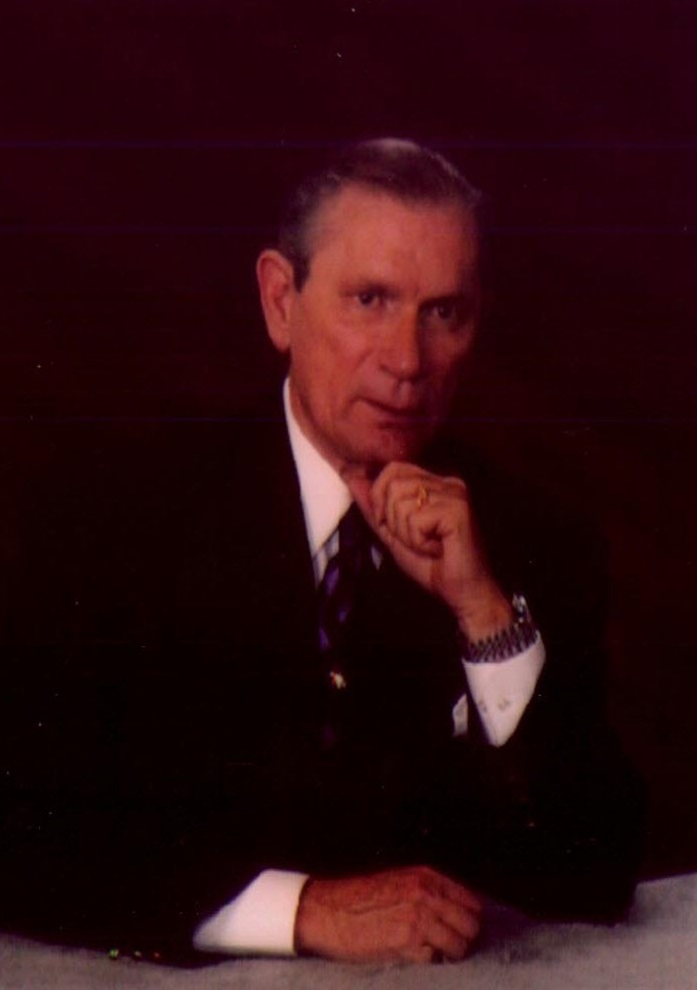 Photograph of a man in a suit