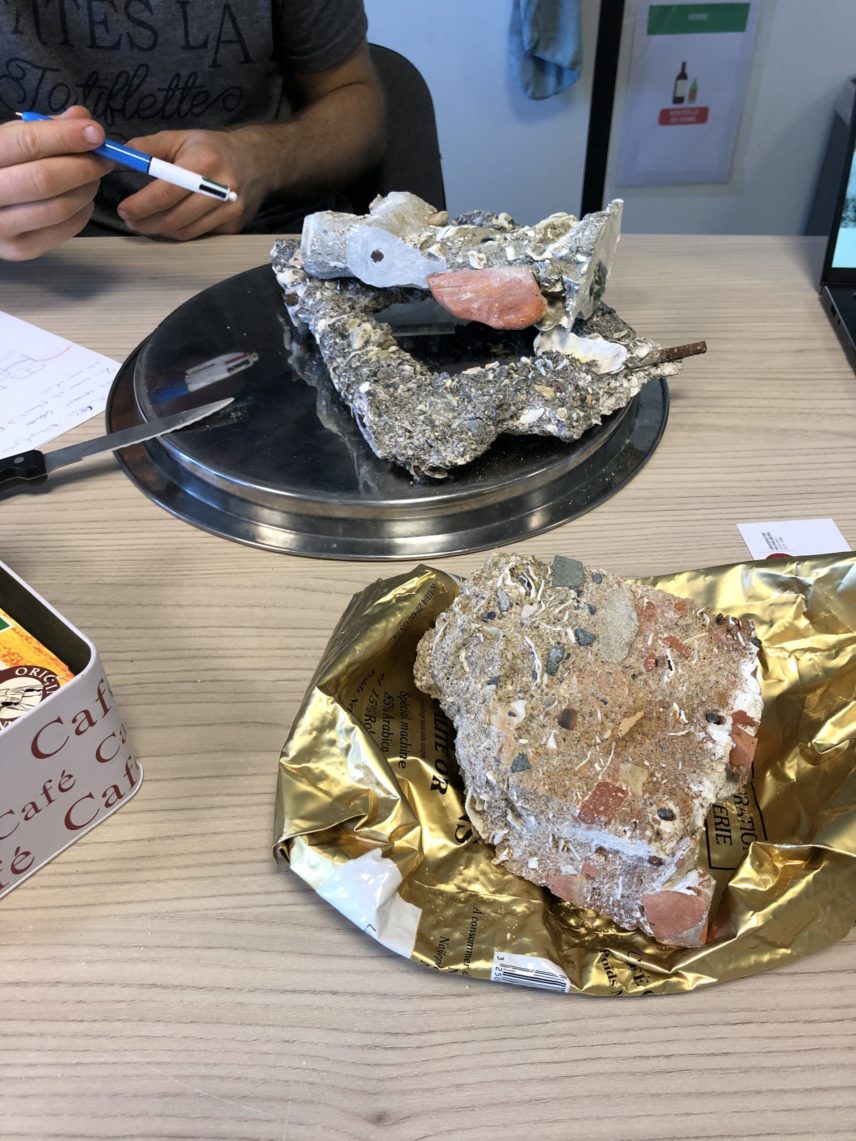 Photograph of concrete and minerals sitting on a table