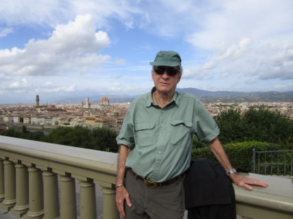 Photograph of a man standing outside