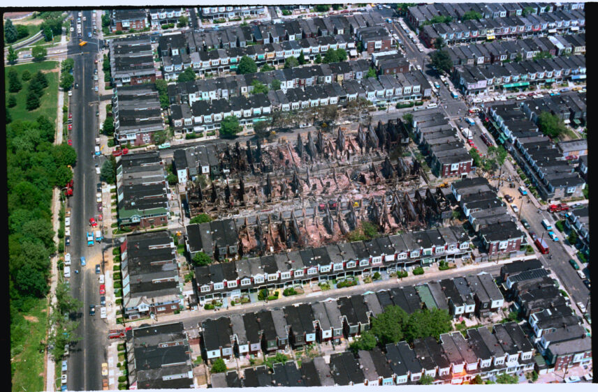 Aerial photograph of the site of a bombing and fire.