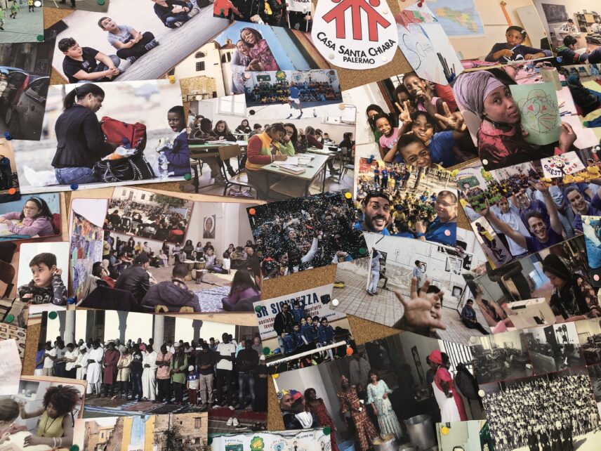 Photograph of a bulletin board with multiple photos pinned to it