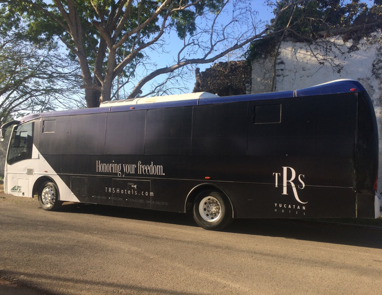 Photograph of a large, black bus