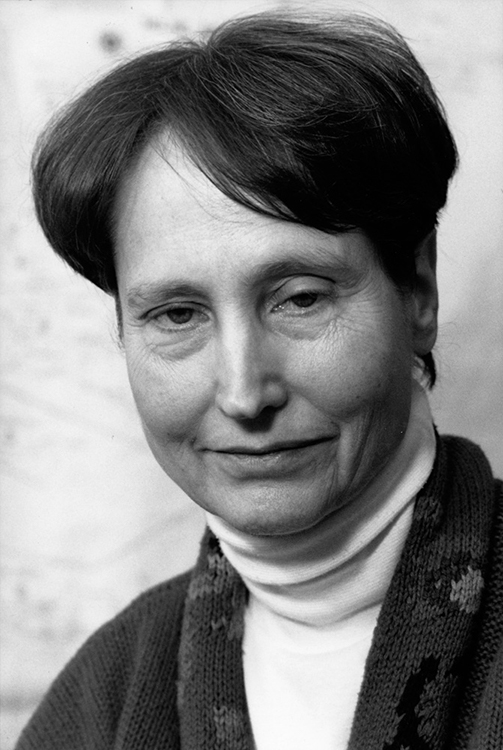 Black and white headshot of a short-haired woman