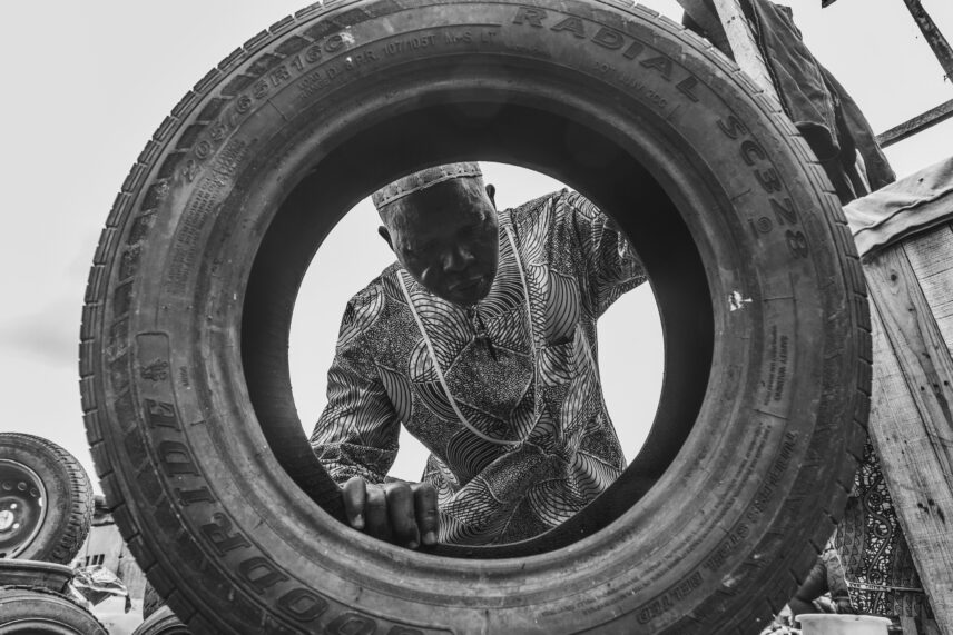 Photo of a man looking at a tire