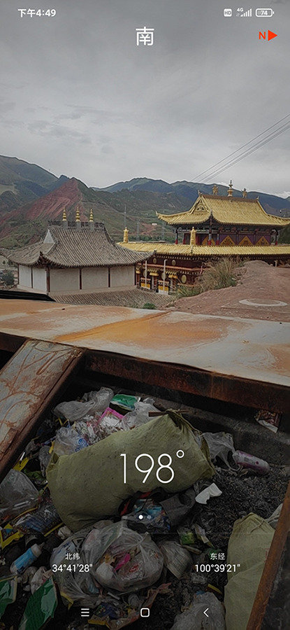 Screenshot taken on a phone of a photo of an overfull trash can.