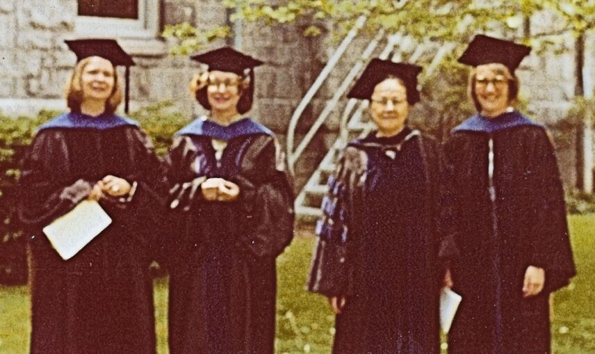 Photograph of four women in academic regalia