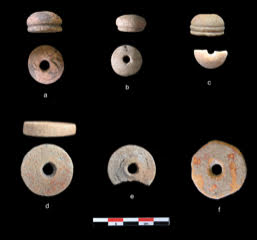 A photograph of six discs