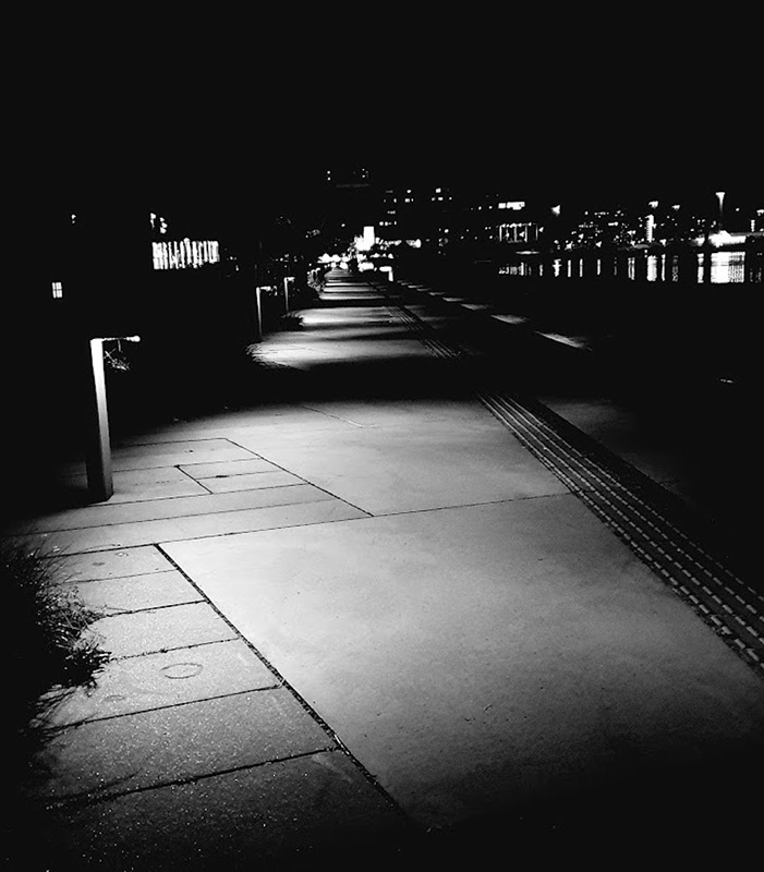 Black and white photograph outdoors at night