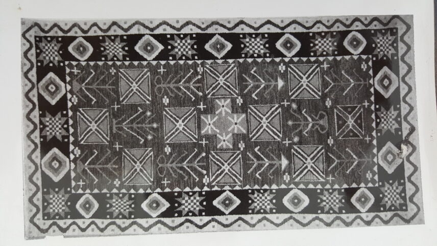 Black and white photograph of a carpet