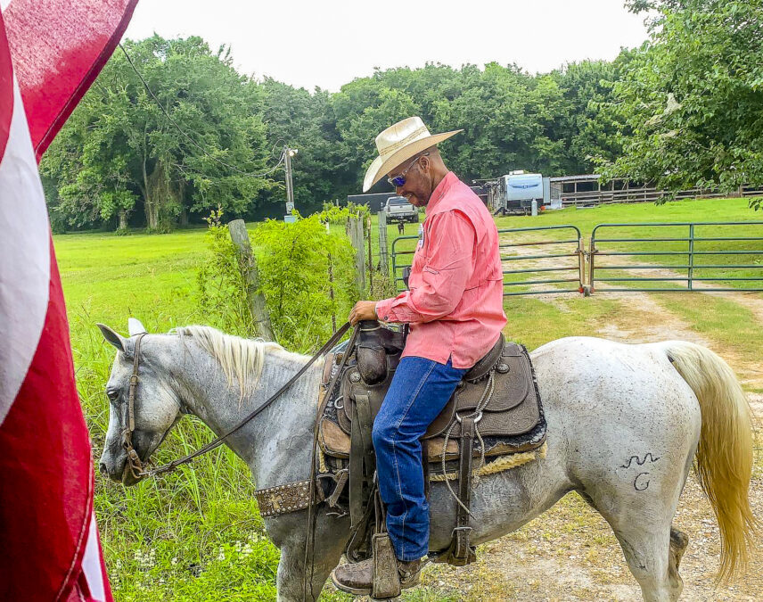 Photograph of a man on horseback