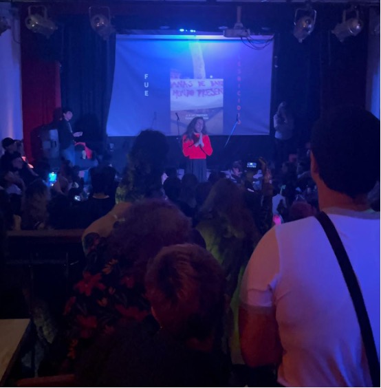 Picture of patrons in Brandon Casa Cultural watching La Ferni singing on stage