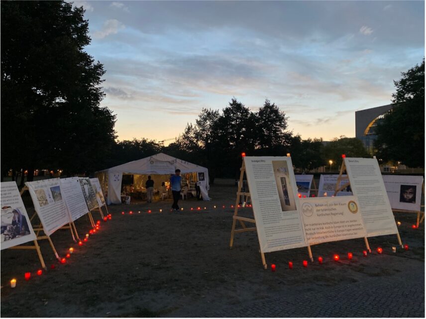 Posters and lit candles at the Veto-G camp.